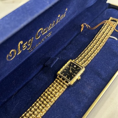 Vintage Oleg Cassini Ladies Gold Tone W/Diamond & Black Face Quartz Watch 7 1/2 
