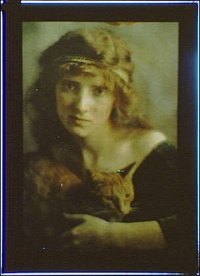 #ad #ad Woman wearing headband holding Buzzercatcolor autochromesArnold Genthe1906 $9.99