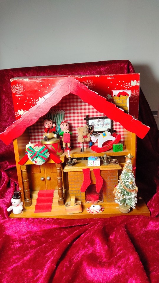 A 1983 Enesco double-action wooden music box that plays 'Toy Land' AND moves — the dual mechanism makes it a step above a typical vintage music box.