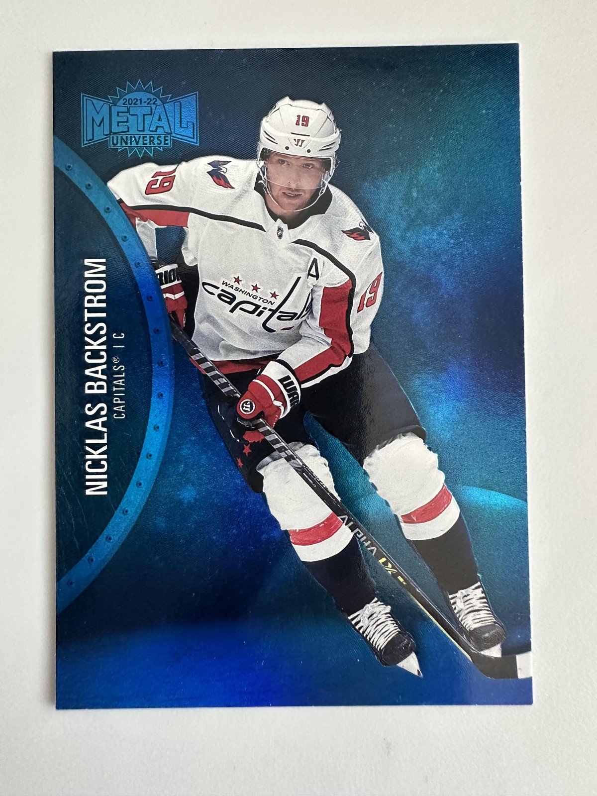 Nicklas Backstrom #83 2021-22 SkyBox Metal Universe Blue Spectrum