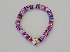 Colorful rainbow clay bracelet with unicorn bead