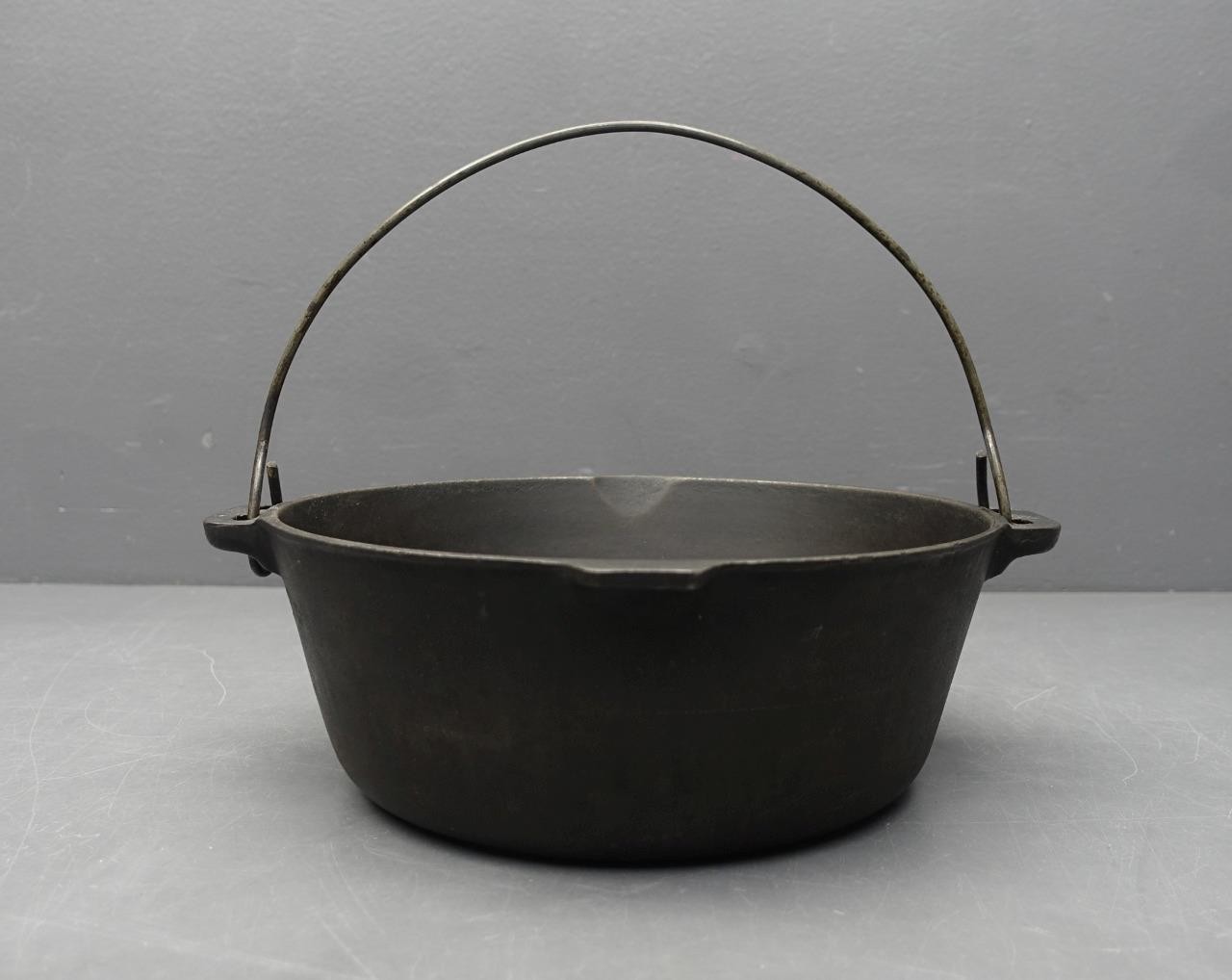 Unmarked 10.75-inch Cast Iron Dutch Oven No Lid with Bail Handle  