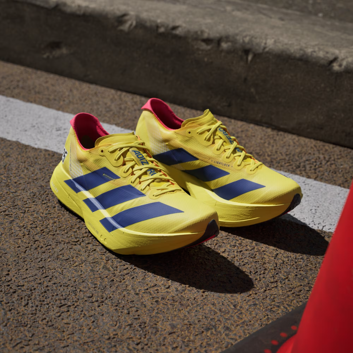 Adizero Adios Pro 4 Running Shoes in Pure Sulfur / Lucid Blue
