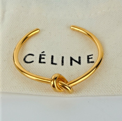 Celine Knoten extra dünner M Armreif Armband in goldfarben Messing