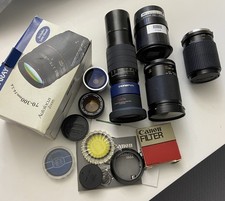 Lot Of Different Types Of Camera Lenses And Accessories