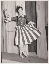 Graceful Young Woman Vintage Ballet Dancer in Striped Costume Takes the Stage
