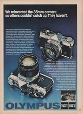 1979 Olympus OM-1/OM-2 Cameras - "We Reinvented The 35mm Camera"- Print Ad Photo