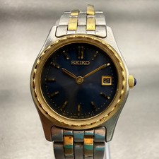 Reloj Seiko Mujer 25mm Esfera Azul Dos Tonos Fecha Redondo V789-0340 Batería Nueva De Colección