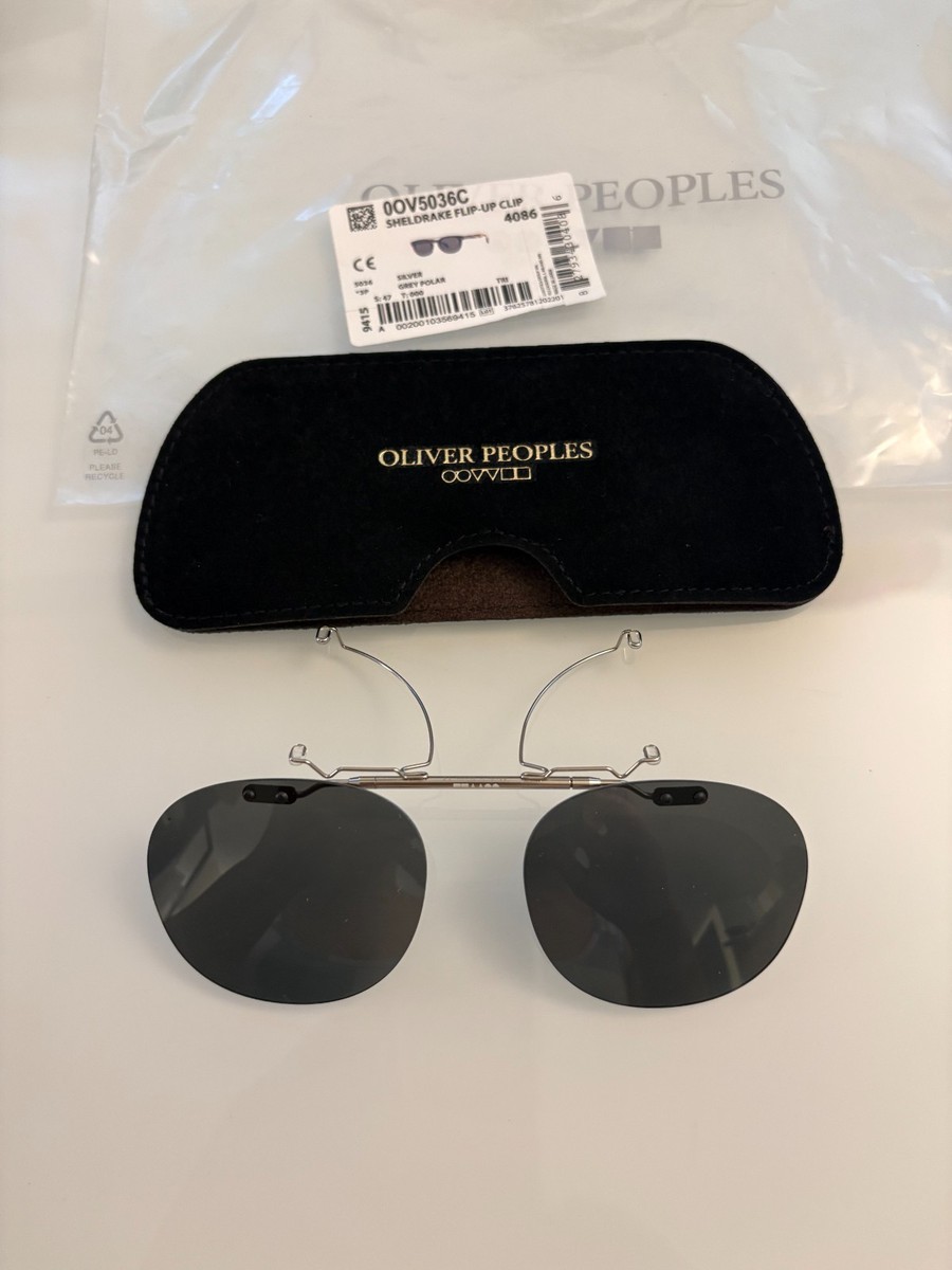 SHELDRAKE FLIP-UP CLIP -ON(OV5036C) GREY POLAR 47MM MSRP$259 frame