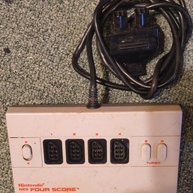 2 Controllers, Four Score,Turbo Blaster, NESadvantage,Power supply, & RF adapter