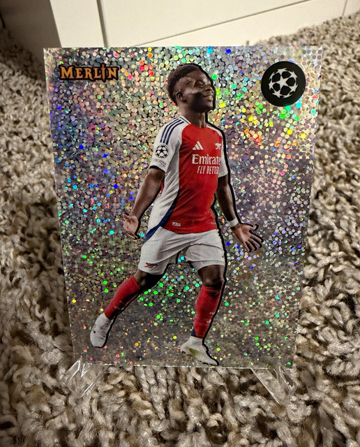 Topps Merlin 2024-25 UEFA Club Competitions The Shiny Bukayo Saka S-7 Arsenal