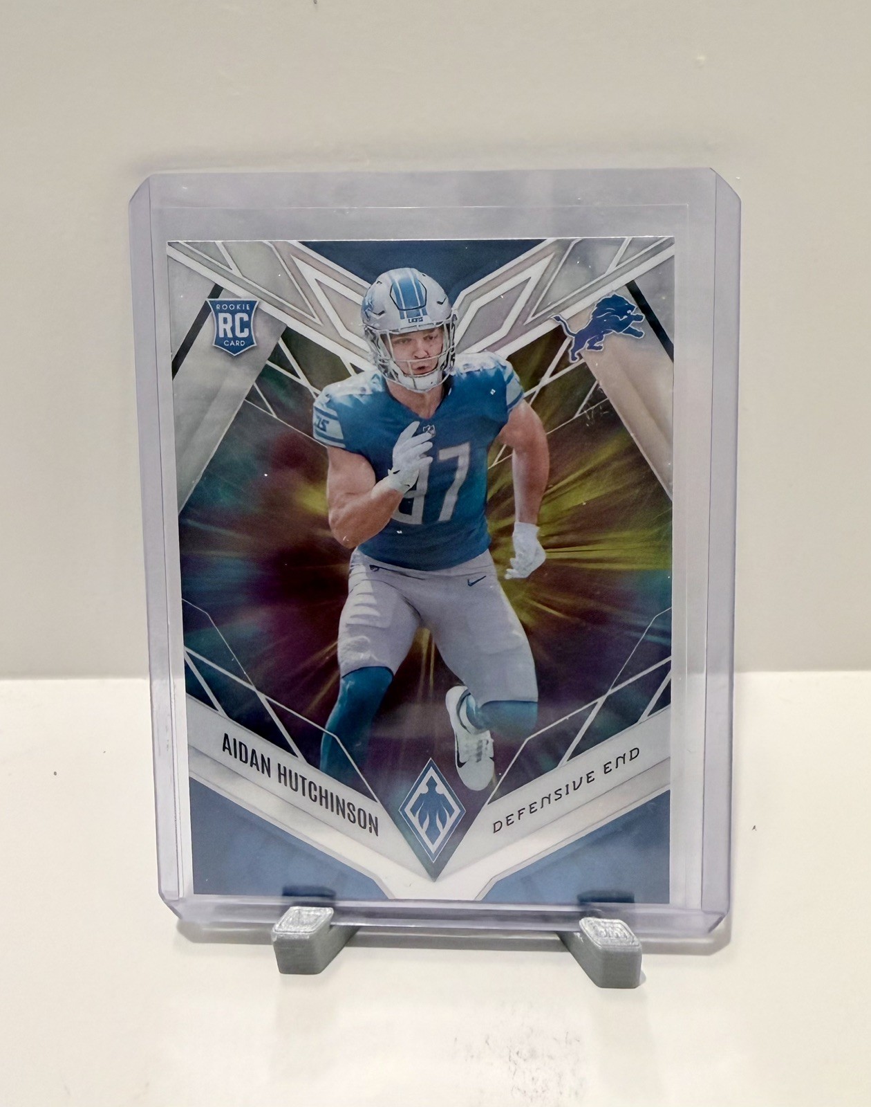 2022 Panini Phoenix - Rookies Aidan Hutchinson #113 Color Burst (RC) Lions