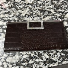 Small brown crocodile-embossed evening clutch with a rhinestone clasp