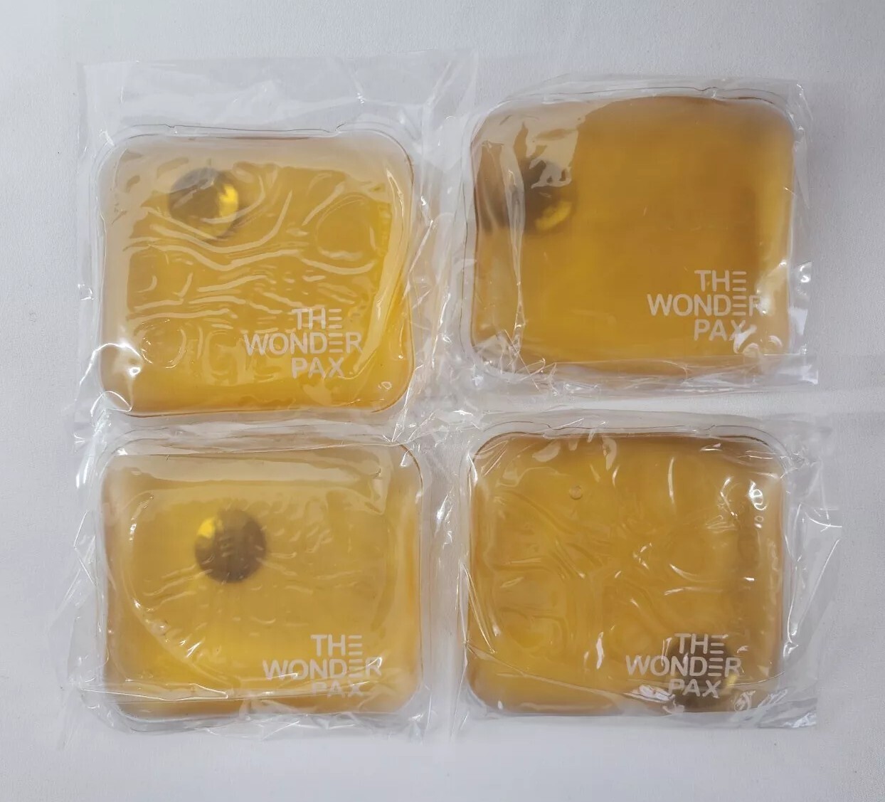 The Wonder Pax Square Hand Pads - Reusable Cool/Warm Gel Pads - Orange - 4 Pack
