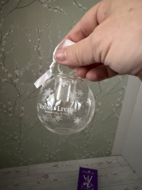 Young Living Glass Snowflake Christmas Glass Diffuser with snowflake detail.