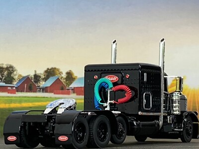 1/64 DCP BLACK PETERBILT 389 TRI AXLE W/ 63