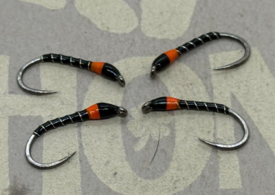 4ea. Black and Orange Buzzers Size #10. Excellent still water pattern.