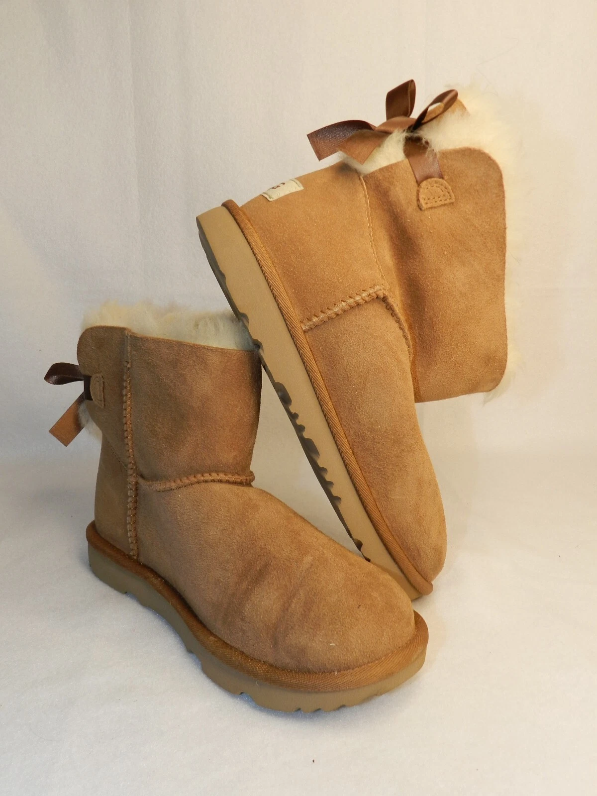 Stivali da neve invernali UGG donna 4 mini Bailey marrone scamosciato pull on pelle di pecora piatti