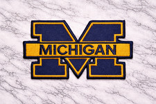MICHIGAN WOLVERINES LOGO NCAA EMBROIDERED IRON ON PATCH 3.25"X2" FREE TRACKING