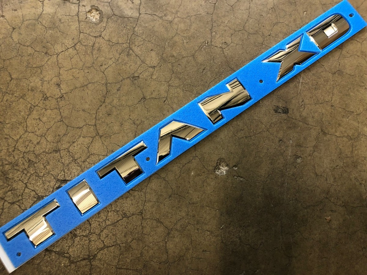 NEW OEM NISSAN TITAN CHROME SIDE DOOR EMBLEM 