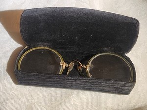 antique round eyeglasses in case