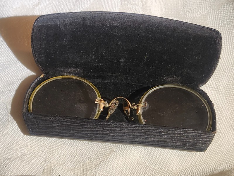 antique round eyeglasses in case