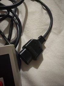 This image shows an original Nintendo Entertainment System (NES) controller