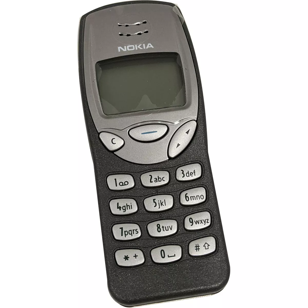 The legendary Nokia 3210, Nokia's very first mobile phone without an  external antenna. This one sports a more unusual, red housing instead of  the standard dark grey one. The original colored covers