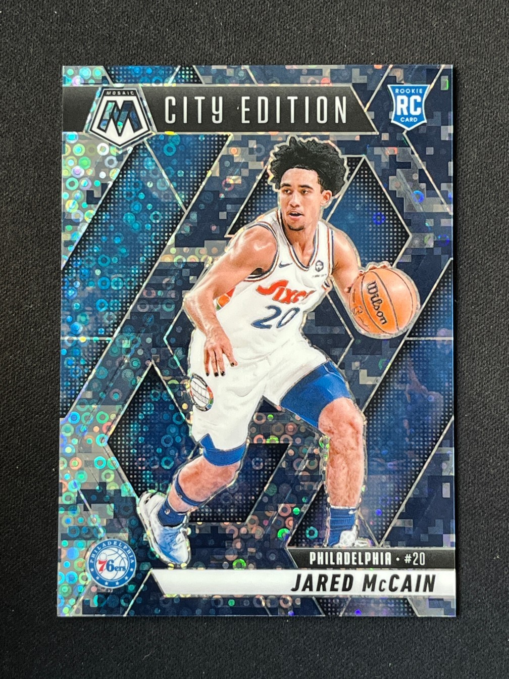 Jared McCain 2024-25 Panini Mosaic City Edition Blue Camo Disco Prizm 24/35 RC