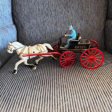 Vintage reproduction cast iron horse and P.D. chief wagon toy