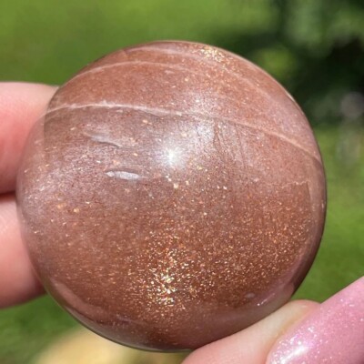 Peach Sunstone Sphere with a Star Golden Silver Flash