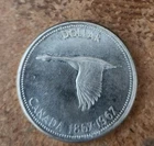 1967 uncirculated Canadian 80% silver dollar