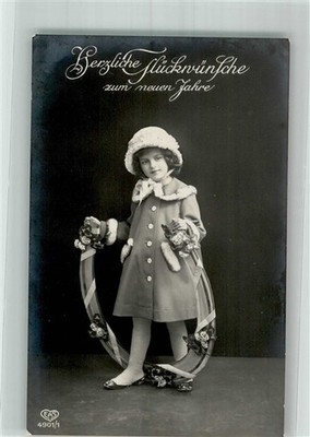 38180325 - Little Girl with Large Flowers Decorated Horseshoe E.A.S.