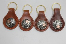 SET OF 4 LEATHER KEYCHAINS WITH SILVER AND COPPER COLOR CONCHOS