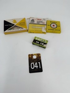 Vintage office supplies including stars, correction tape, dots, and staples.