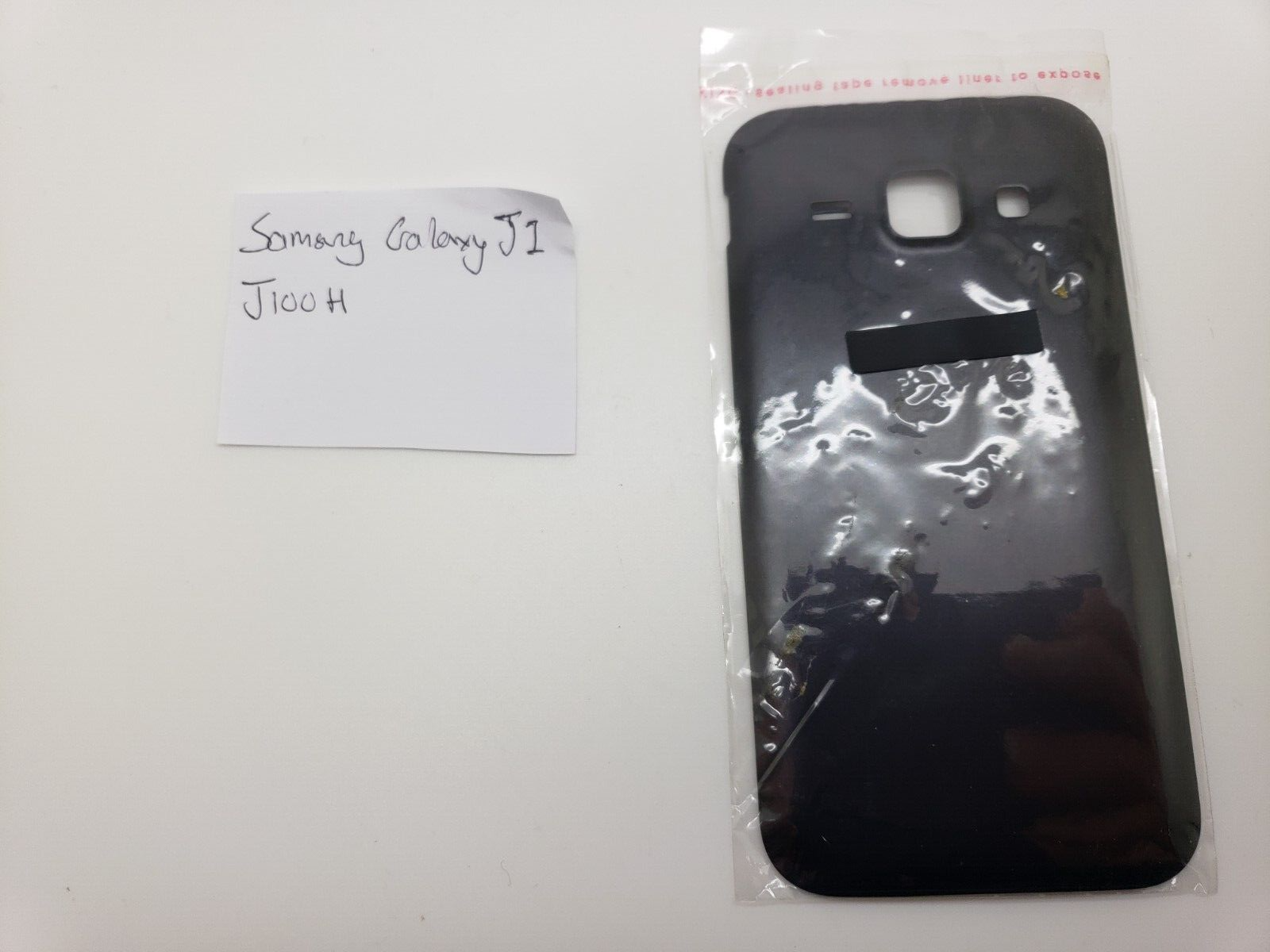 New Old Stock Genuine Samsung Galaxy J1 SM-J100H Black Battery Cover