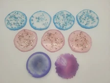 Lot of 9 miscellaneous resin coasters.