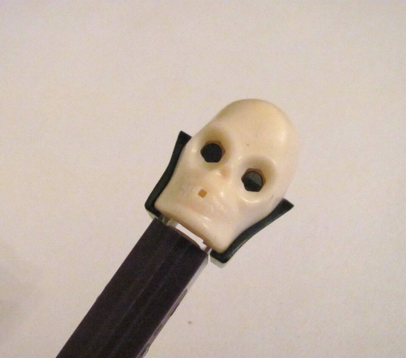 PRE-OWNED PEZ DISPENSER ~ DR. SKULL (RETIRED) LIGHTER HEAD