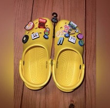 CROCS unisex yellow men's 6 / women's 8 with charms.