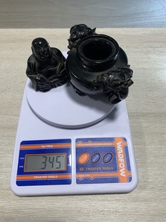 345 grams of cherry amber bakelite statues