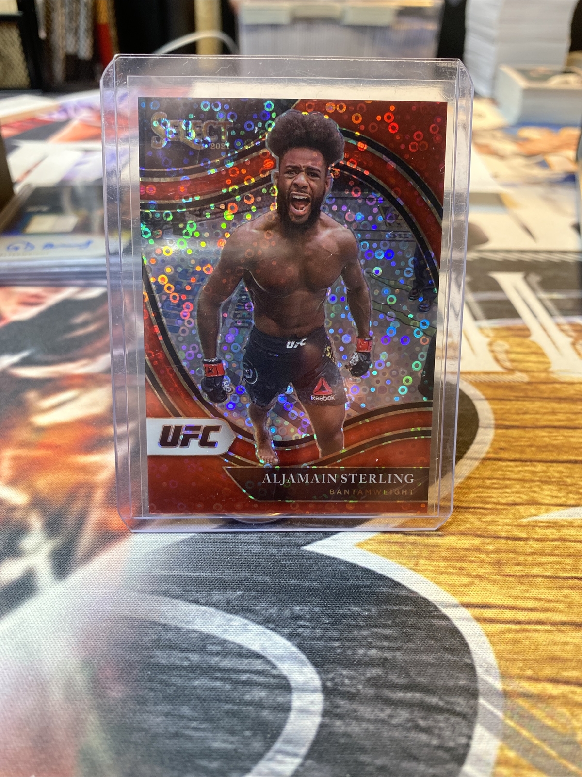 2021 Panini SELECT UFC ALJAMAIN STERLING OCTAGONSIDE RED DISCO PRIZM #/199