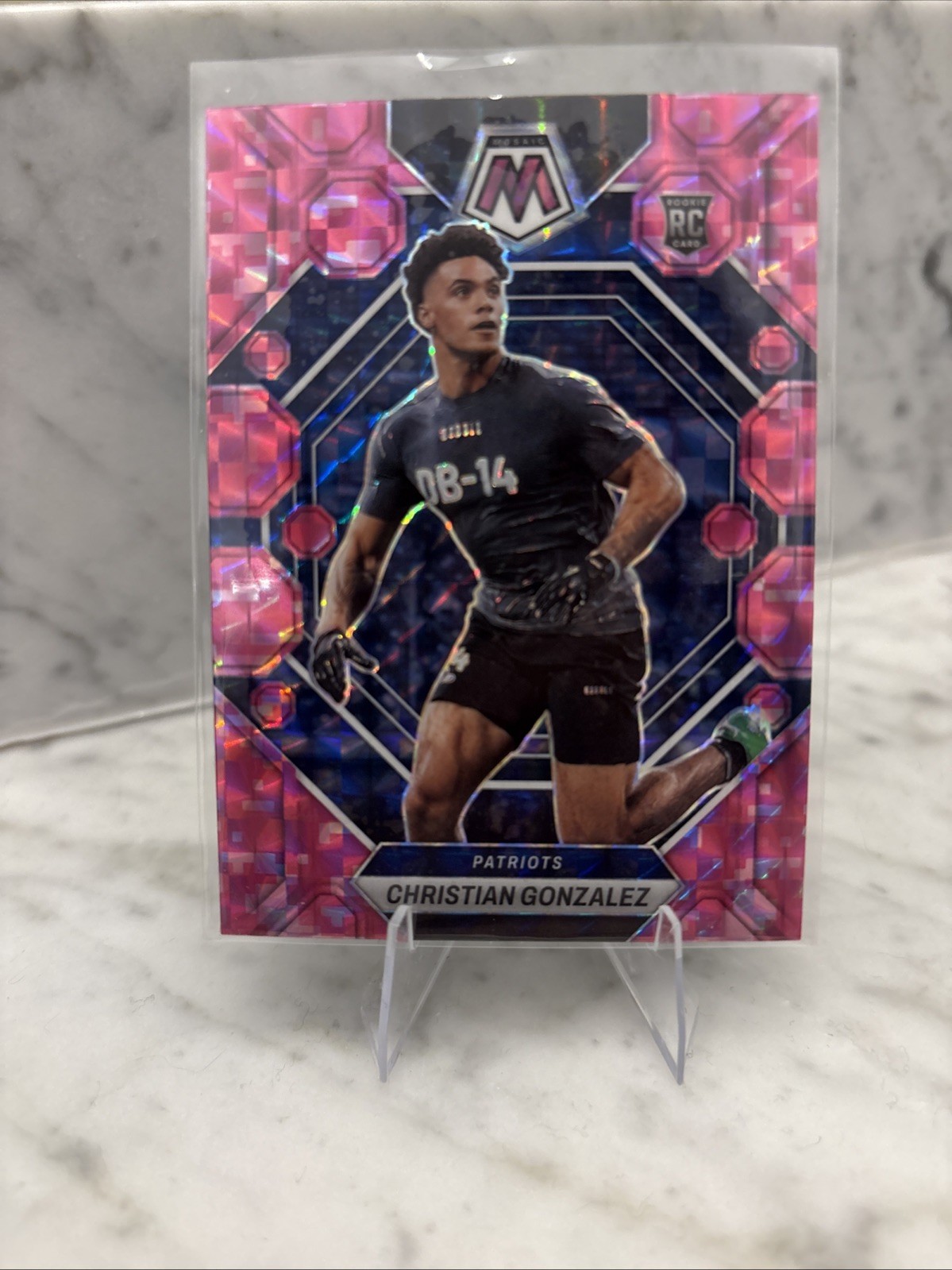 2023 Panini Mosaic - Rookies Christian Gonzalez #300 Camo Pink Mosaic Prizm (RC)