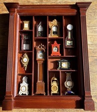 12 VINTAGE FRANKLIN MINT MINIATURE CLOCK COLLECTION IN DISPLAY CASE - 1988