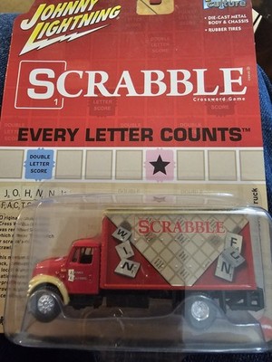 Johnny Lightning JLPC007 Pop Culture 1999 International Cargo Truck Scrabble