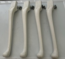 SET OF FOUR WHITE SOLID HARD PLASTIC FURNITURE LRGS TABLE LEGS 15” TALL.