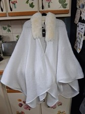 inc. WOMANS CAPE WITH FUR COLLAR TAG