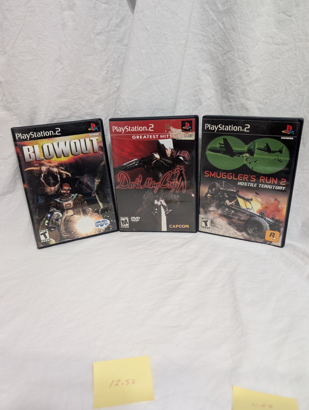 673 PS2 Smugglers Run 2 Devil May Cry Blow Out
