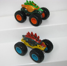 2 Hot Wheels Stegosaurus Dinosaur Monster Trucks 1:64 Jam Diecast Mattel Green