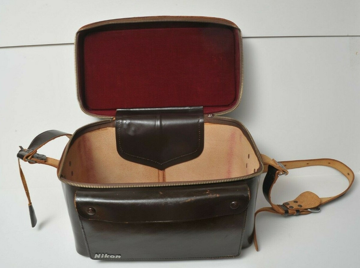 Vintage Nikon hard leather camera bag with purple velvet covered metal inserts