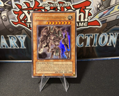 Yu-Gi-Oh Antiker Antriebsgolem TLM-DE006 1. Auflage UR Deutsch NM Near Mint Rar
